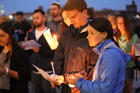 Brett and Bridget Hutchinson of St. Thomas More in St. Paul, Minn., pray with other young adults gathered on the steps of the Cathedral of St. Paul Aug. 20 during a vigil called "Evening Prayer for the Survivors of Clerical Abuse and the Healing of the Church." (CNS photo/Dave Hrbacek, The Catholic Spirit) 