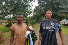 Refugees from Cameroon in the Nigerian village of Agbokim with clothes donated by humanitarian organizations. (Shola Lawal)