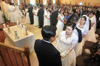 Couples exchange vows during a wedding service at St. Michael the Archangel Church in Georgetown, Del., on Feb. 14, 2010. (CNS photo/Don Blake, The Dialog)