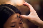 A woman receives ashes on Feb. 14, 2018, at St. Patrick's Cathedral in New York City. (CNS photo/Adrees Latif, Reuters) 