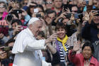 Pope Francis greets the crowd during his general audience in St. Peter’s Square at the Vatican on May 1. (CNS photo/Paul Haring)