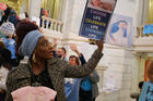 Elizabeth Koroma protests in the Rhode Island Statehouse on May 14 against state legislation aimed at expanding legal abortion. (CNS photo/Brian Fraga, Rhode Island Catholic)