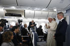 Pope Francis answers questions from reporters aboard his flight from Tokyo to Rome on Nov. 26, 2019. (CNS photo/Paul Haring)