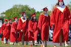 Graduating seniors line up to receive their diplomas after exiting their vehicles during a drive-in commencement on June 14, 2020, at St. John the Baptist Diocesan High School in West Islip, N.Y. (CNS photo/Gregory A. Shemitz)