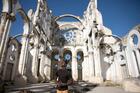 A man stops at the ruins of the Cathedral of Our Lady of the Assumption in Port-Au-Prince, Haiti, on Jan. 10, 2020. The church was destroyed in the 2010 earthquake that killed an estimated 220,000 people and left 1.5 million homeless in the island nation. (CNS photo/Valerie Baeriswyl, Reuters)