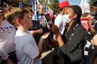 Supporters of President Donald Trump and Democratic presidential nominee Joseph Biden approach each other on a street in Raleigh, N.C., on Nov. 7, after major news media declared that Mr. Biden had won the presidential election. (CNS photo/Jonathan Drake, Reuters)