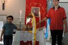 Matheus Vianna and Gabriel Terron pose before a relic of Carlo Acutis in 2015. Photo courtesy of St. Sebastian's church in Campo Grande, Mato Grosso do Sul, Brazil.