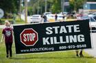 In July demonstrators show their opposition to the death penalty outside the Federal Correctional Complex in Terre Haute, Ind., where federal executions are conducted. (CNS photo/Bryan Woolston, Reuters)