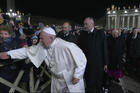 A woman pulls Pope Francis' hand as he greets people while walking to visit the Nativity scene in St. Peter's Square at the Vatican Dec. 31, 2019. At his Jan. 1 Angelus the pope apologized for the "bad example" he gave when he slapped this woman's hand. (CNS photo/Vatican Media)