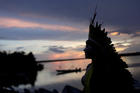 A leader of the Celia Xakriaba peoples walks along the banks of the Xingu River, a tributary of the Amazon, in Brazil’s Xingu Indigenous Park on Jan. 15, 2020. (CNS photo/Ricardo Moraes, Reuters)