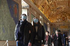 People wearing masks for protection from the coronavirus tour the Vatican Museums at the Vatican Feb. 29. (CNS photo/Paul Haring)