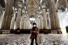 A tourist wearing a protective mask visits Milan's famed cathedral, commonly referred to as the "Duomo," as it reopened to the public March 2, 2020, for the first time since the coronavirus outbreak. (CNS photo/Yara Nardi, Reuters) 