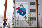 A mural depicts a nurse embracing the shape of Italy posted on the hospital of Pope John XXIII in solidarity with the health workers in Bergamo on March 13, 2020. (CNS photo/Sergio Agazzi, IPA/ABACAPRESS.COM via Reuters) 