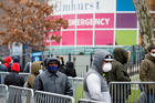 People wearing protective gear wait in line to be tested for the coronavirus (COVID-19) outside Elmhurst Hospital Center in the Queens borough of New York City March 25, 2020. (CNS photo/Stefan Jeremiah, Reuters)