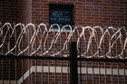 Signs made by Cook County Jail prisoners in Chicago plead for help April 7, 2020, during the coronavirus pandemic. (CNS photo/Jim Vondruska, Reuters)