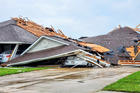 Damaged buildings and vehicles in Monroe, La., are seen in the aftermath of a tornado April 12, 2020. The National Weather Service reported April 13 that more than 30 tornadoes ripped across Texas, Louisiana, Mississippi and Georgia. (CNS photo/Peter Tuberville, social media via Reuters) 