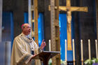 Archbishop William E. Lori of Baltimore delivers Easter Mass homily in the nearly empty Cathedral of Mary Our Queen. Archbishop Lori is among the U.S. church leaders who have released guidelines for reopening parishes. (CNS photo/Kevin Parks, Catholic Review)