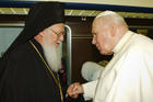 St. John Paul II greets Ecumenical Patriarch Bartholomew in 2002. Marking the 25th anniversary of St. John Paul II's encyclical on Christian unity, Pope Francis said he shares "the healthy impatience" of those who think more can and should be done, but he also insisted that Christians must be grateful for the progress made. (CNS photo/Reuters) 