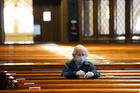 Alice Claus prays the rosary at St. Kevin Church in the Flushing section of the New York City borough of Queens on May 26, the first day the Diocese of Brooklyn, N.Y., permitted its churches to reopen amid the COVID-19 pandemic. (CNS photo/Gregory A. Shemitz) 