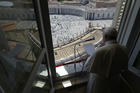 Pope Francis greets the faithful from the window of his studio overlooking St. Peter’s Square on May 31. The pope led the Sunday prayer from his window for the first time in three months, after the square was reopened. (CNS photo/Vatican Media)