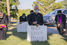  Bishop Mark J. Seitz of the Diocese of El Paso, Texas, kneels at El Paso's Memorial Park holding a Black Lives Matter sign June 1, 2020. Bishop Seitz and other clergy from the Diocese of El Paso, prayed and kneeled for eight minutes, the time George Floyd, an unarmed black man, was said to have spent under a police officer's knee before becoming unconscious and later dying May 25, 2020. (CNS photo/Fernie Ceniceros, courtesy Diocese of El Paso) 