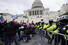 Trump supporters try to break through a police barrier on Jan. 6 at the Capitol in Washington. (AP Photo/Julio Cortez)