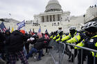 Trump supporters try to break through a police barrier on Jan. 6 at the Capitol in Washington. (AP Photo/Julio Cortez)