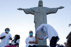 First day of vaccinations against Covid-19 on Jan.18, at Christ the Redeemer, during an event hosted by the Archdiocese in Rio de Janeiro. Terezinha da Conceição receives her shot from nursing technician Dulcinéia da Silva Lopes. Fernando Frazão/Agência Brasil