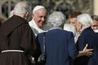 Pope Francis greets people during an encounter with the elderly in St. Peter's Square at the Vatican in this Sept. 28, 2014, file photo. During his Jan. 31 Sunday Angelus, the pope announced the establishment of a World Day of Grandparents and the Elderly. (CNS photo/Paul Haring)