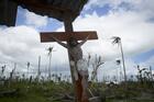 A crucifix is displayed in Barangay Cabarasan Guti, a community in Tanauan, Philippines, Feb. 6, 2014. Obedience means to hear the word of God and act on it. (CNS photo/Tyler Orsburn)