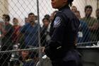 A Customs and Border Protection agent monitors detainees at a Border Patrol station in McAllen, Texas, on July 12, 2019. (CNS photo/Veronica G. Cardenas, Reuters)