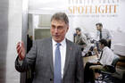 Marty Baron, former editor of The Boston Globe, walks the red carpet as he attends the Boston area premiere of the film "Spotlight" at the Coolidge Corner Theatre, in Brookline, Mass, Oct. 28, 2015. (AP Photo/Steven Senne, File)