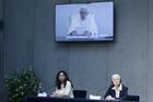 Pope Francis delivers a recorded message during a news conference to unveil a new platform for action based on his 2015 encyclical “Laudato Si'” at the Vatican on May 25. At the dais are Carolina Bianchi, who works with the Global Catholic Climate Movement, and Sister Sheila Kinsey, co-secretary of the Justice, Peace and Integrity of Creation Commission of the International Union of Superiors General. (CNS photo/Paul Haring)