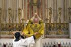 Father Stephen Saffron, parish administrator, elevates the Eucharist during a traditional Latin Mass July 18, 2021, at St. Josaphat Church in the Queens borough of New York City. (CNS photo/Gregory A. Shemitz)