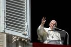 Pope Francis, seen here at the window of his studio overlooking St. Peter's Square, received a copy of Hidden Mercy: AIDS, Catholics, and the Untold Stories of Compassion in the Face of Fear this summer. (CNS photo/Vatican Media)