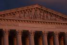 The sun sets at the U.S. Supreme Court building in Washington Nov. 29, 2021.