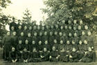 a group of jesuits in seminary pose in a 1921 photo