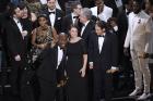 Barry Jenkins, foreground left, and the cast accept the award for best picture for "Moonlight" at the Oscars on Sunday, Feb. 26, 2017, at the Dolby Theatre in Los Angeles. (Photo by Chris Pizzello/Invision/AP)