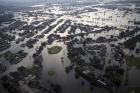 Floodwaters from Tropical Storm Harvey surround homes in Port Arthur, Texas, on Aug. 31. (AP Photo/Gerald Herbert)