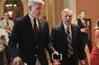 Sen. Bill Cassidy, R-La., left, and Sen. Lindsey Graham, R-S.C., right, talk while walking to a meeting on Capitol Hill in Washington in July. Senate Republicans are planning a final, uphill push to erase President Barack Obama's health care law. But Democrats and their allies are going all-out to stop the drive. (AP Photo/Pablo Martinez Monsivais, File)
