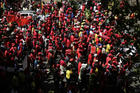 Workers march in Johannesburg, South Africa, on Sept. South Africa's biggest union group held marches nationwide to protest what it alleges is chronic corruption fueled by President Jacob Zuma and a prominent family of businessmen, reflecting public anger over a scandal that has ensnared several international companies. (AP Photo/Themba Hadebe)