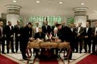 Senior Fatah official Azzam al-Ahmad, center right, and Hamas' representative, Saleh al-Arouri, center left, sign a reconciliation agreement during a press conference at the Egyptian intelligence complex in Cairo, Egypt, Thursday, Oct. 12, 2017. Thursday's signing came after two days of negotiations in the Egyptian capital on the governing of the Gaza Strip as part of the most serious effort to date to end the 10 year rift between the rival Palestinian groups. (AP Photo/Nariman El-Mofty)