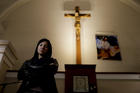 In this Oct. 11, 2017 photo, Yasmin Detez poses for a portrait inside San Jose Obrero church where Rev. Carlos Jose celebrated Mass in Caseros, in the province of Buenos Aires, Argentina. Detez, 25, says she was abused as a child by the Catholic priest. “He’d make me sit on his lap and ask me if I had been naughty while he kissed my neck and fondled me,” Detez said. (AP Photo/Natacha Pisarenko)