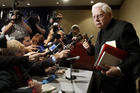 In this Tuesday, Nov. 12, 2002 file photo, Cardinal Bernard Law, right, departs a news conference during the second day of the U.S. Conference of Catholic Bishops annual meeting in Washington (AP Photo/Ken Lambert, File).