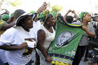 Supporters for president elect Cyril Ramaphosa outside parliament in Cape Town, South Africa, on Feb 15. Mr. Ramaphosa on Thursday was elected as South Africa's new president by ruling party legislators after the resignation of Jacob Zuma. (AP Photo/Nasief Manie)