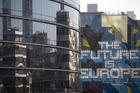 The glass front of a building which houses the translators of the European Commission in Brussels on March 20, 2018. (AP Photo/Virginia Mayo)