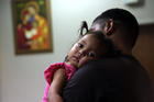 Honduras immigrant seeking asylum, Carlos Fuentes Maldonado holds his daughter Mia, 1, after they were reunited, Monday, July 23, 2018, in San Antonio. (AP Photo/Eric Gay)