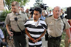 Cristhian Bahena Rivera is escorted into the Poweshiek County Courthouse for his initial court appearance, Wednesday, Aug. 22, 2018, in Montezuma, Iowa. (AP Photo/Charlie Neibergall)