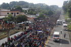 Central American migrants depart from Ciudad Hidalgo, Mexico, on Oct. 21. (AP Photo/Moises Castillo)