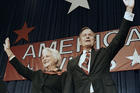 In this Nov. 8, 1988 file photo, President-elect George H.W. Bush and his wife Barbara wave to supporters in Houston, Texas after winning the presidential election. (AP Photo/Scott Applewhite, File)​​​​​​​